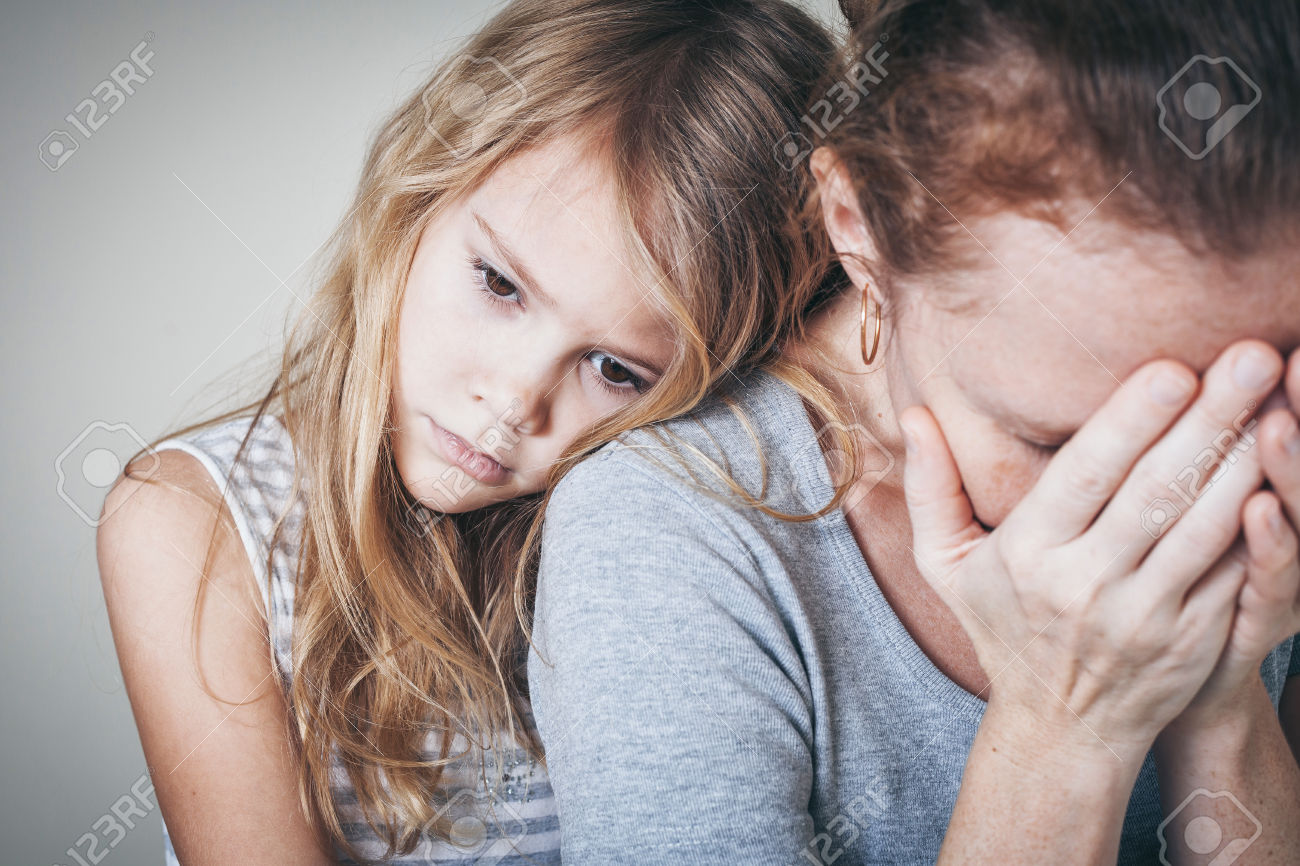 sad daughter hugging his mother