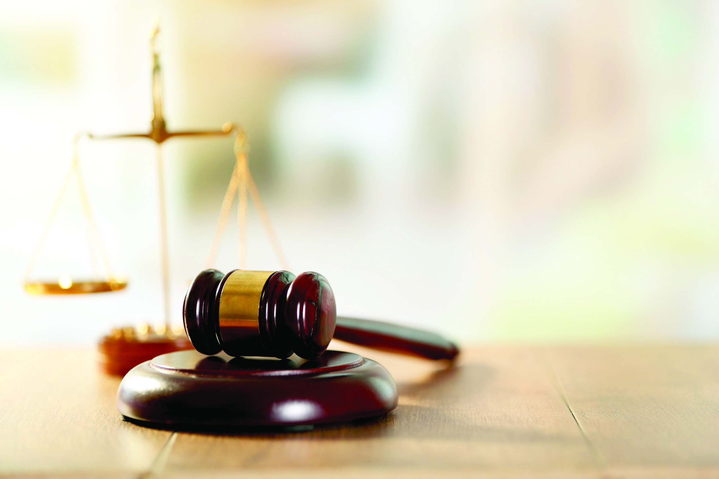 37541052 - wooden judges gavel on wooden table, close up